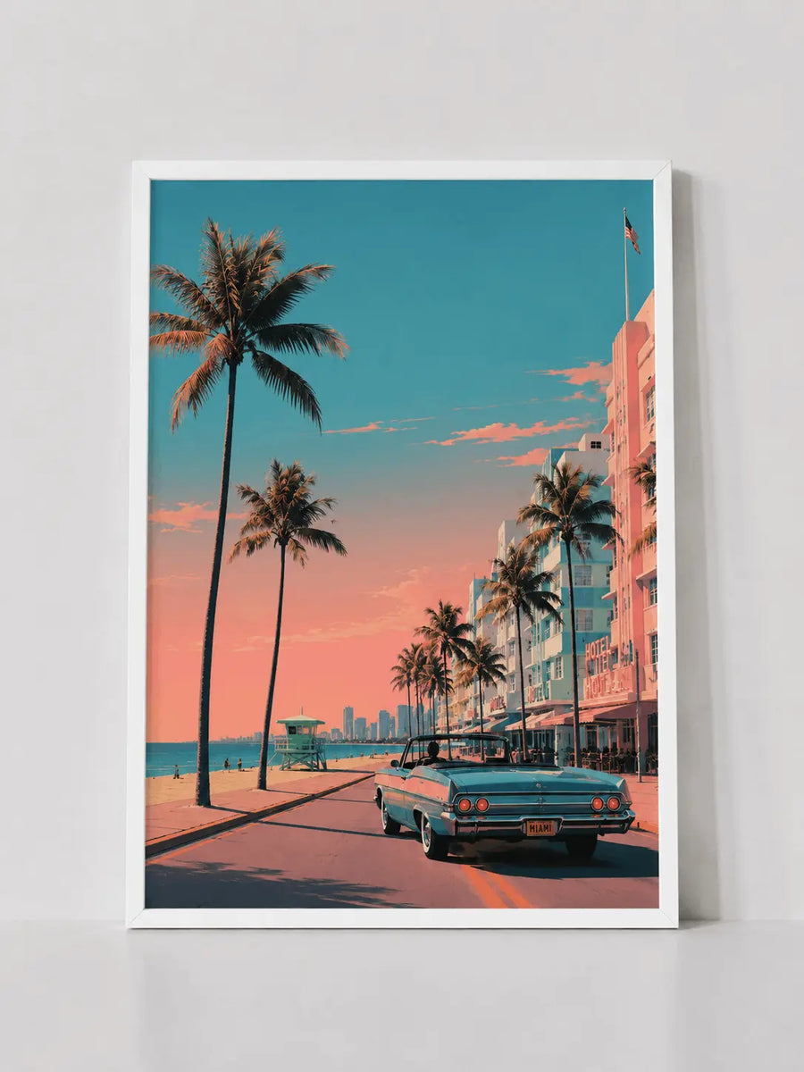 White-framed wall print featuring palm trees and pastel buildings with teal classic car