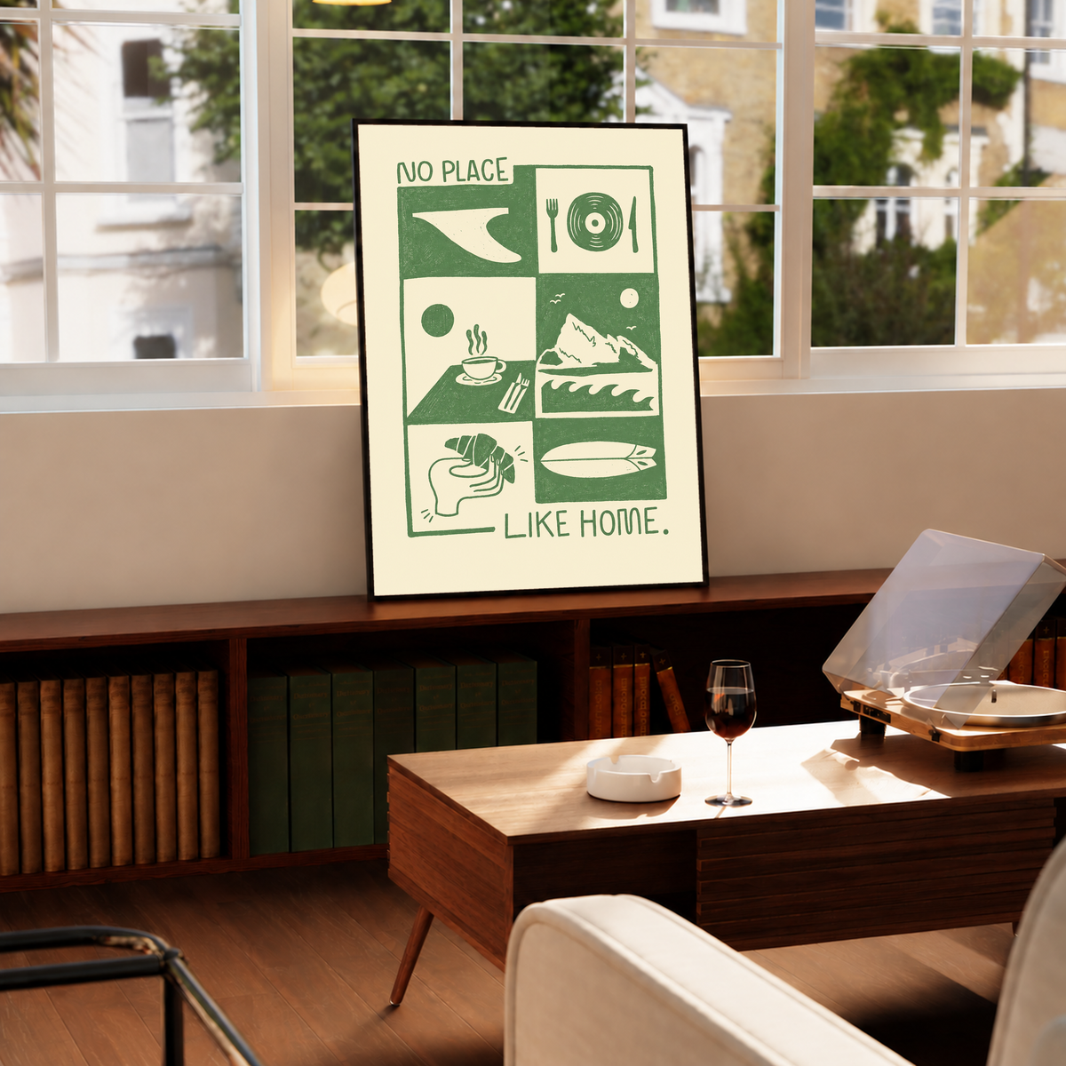 Green-and-cream wall art print with “NO PLACE LIKE HOME” collage, in black frame