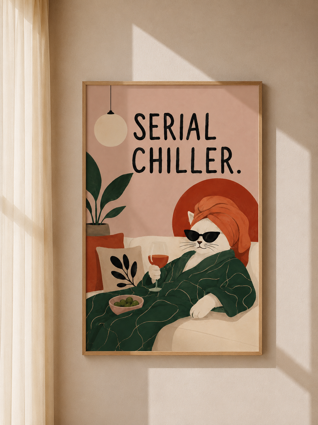 Wood-framed cat art print with orange cat in glasses, green plants, and “Serial Chiller”