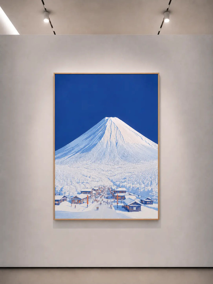 Impresión vertical enmarcada del nevado monte Fuji sobre un pueblo invernal bajo un cielo azul