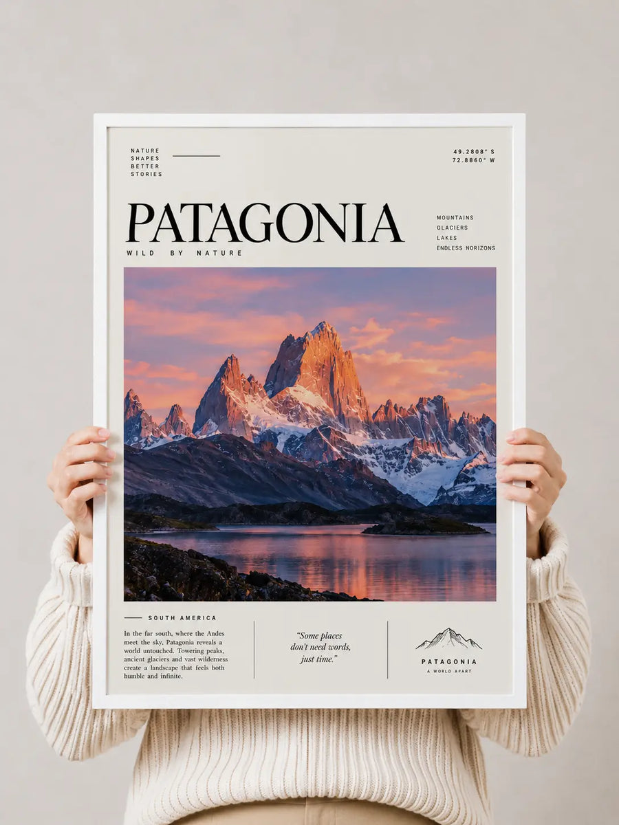 Travel poster print with Patagonia branding held by hands, showing mountain peaks and lake