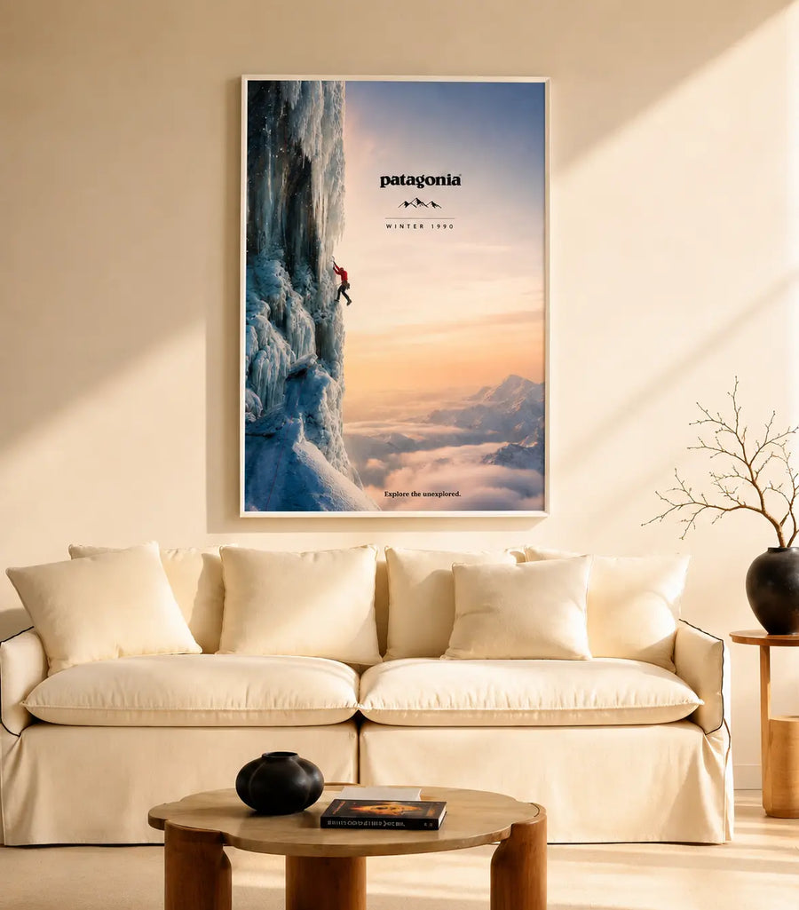Framed mountain landscape print with snowy cliff and sunrise, Patagonia logo