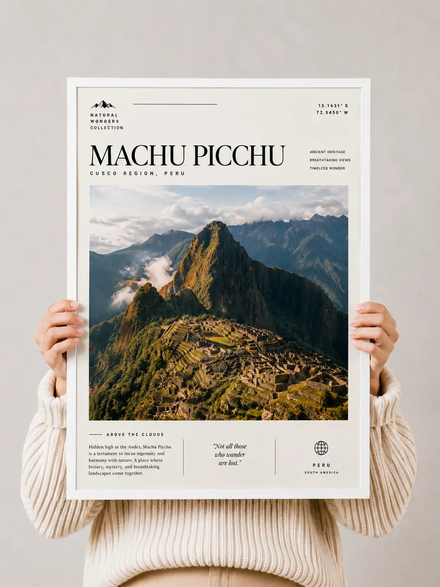 Machu Picchu travel print poster held up, showing mountains, clouds, and ruins