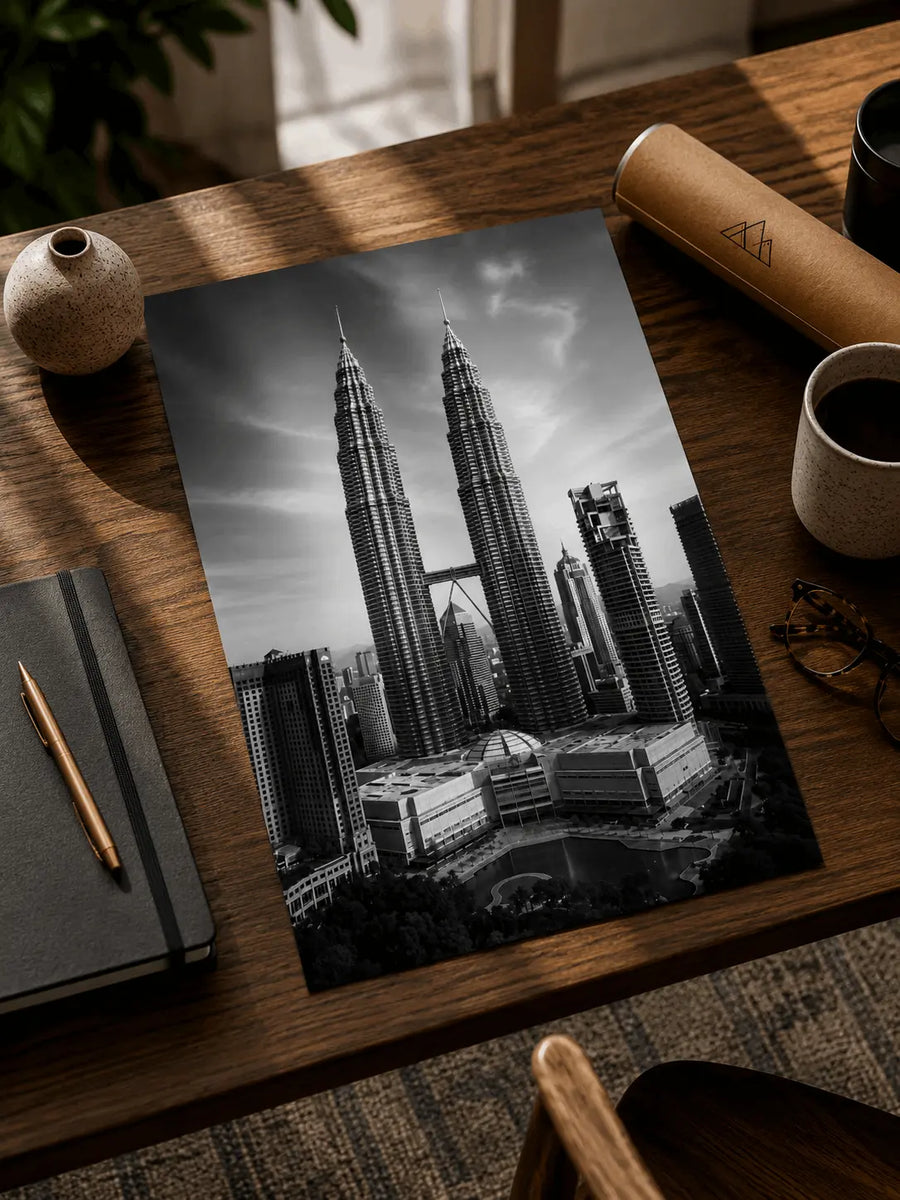 Black-and-white skyline poster with twin towers, viewed from an angle
