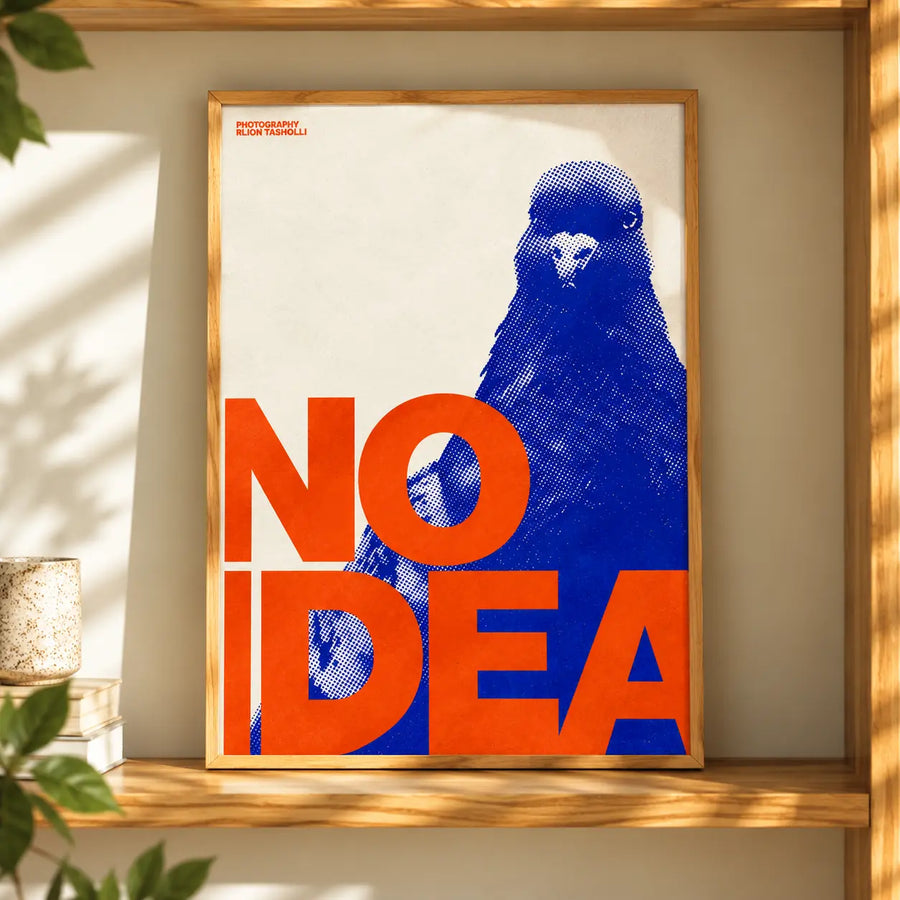 No Idea Pigeon Pop Art Print displayed in a thin natural oak frame with bold orange typography and a blue pigeon design