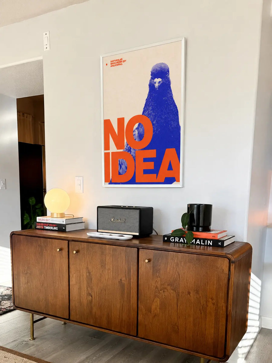Blue pigeon pop art print with red "NO IDEA" text, silver frame