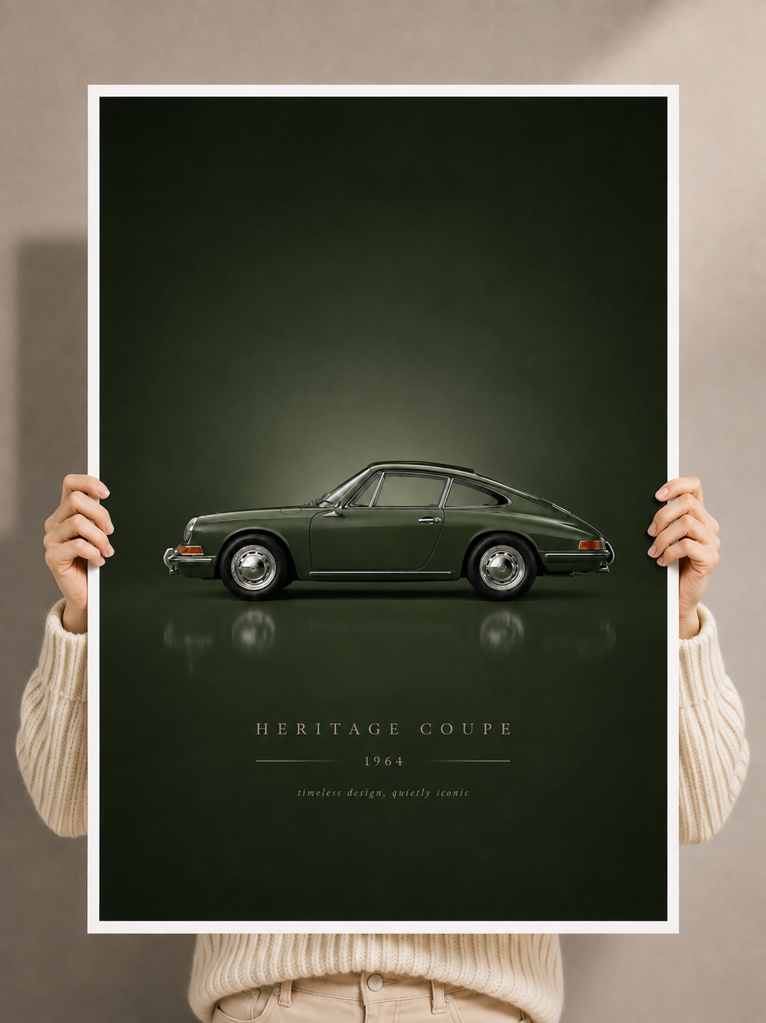Classic sports car poster held by hands, showing green vintage coupe artwork