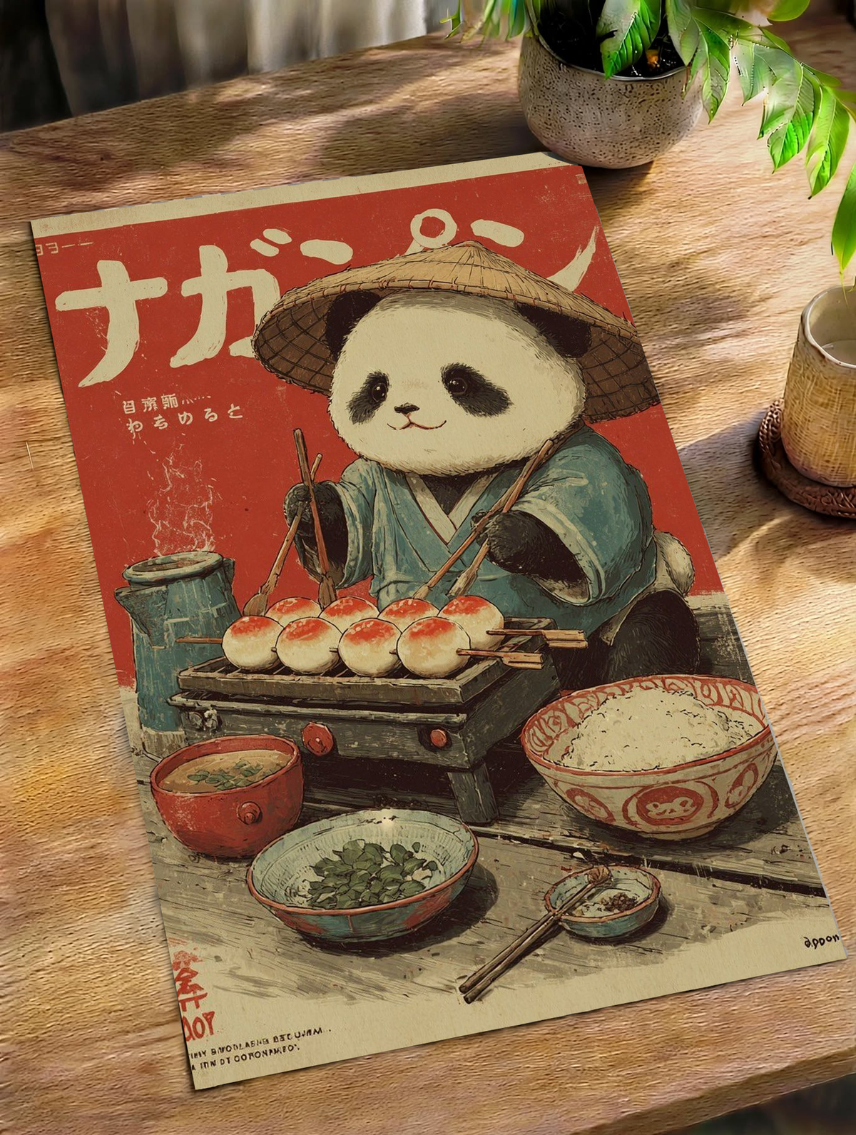 Japanese panda food poster lying on a wooden table beside greenery.