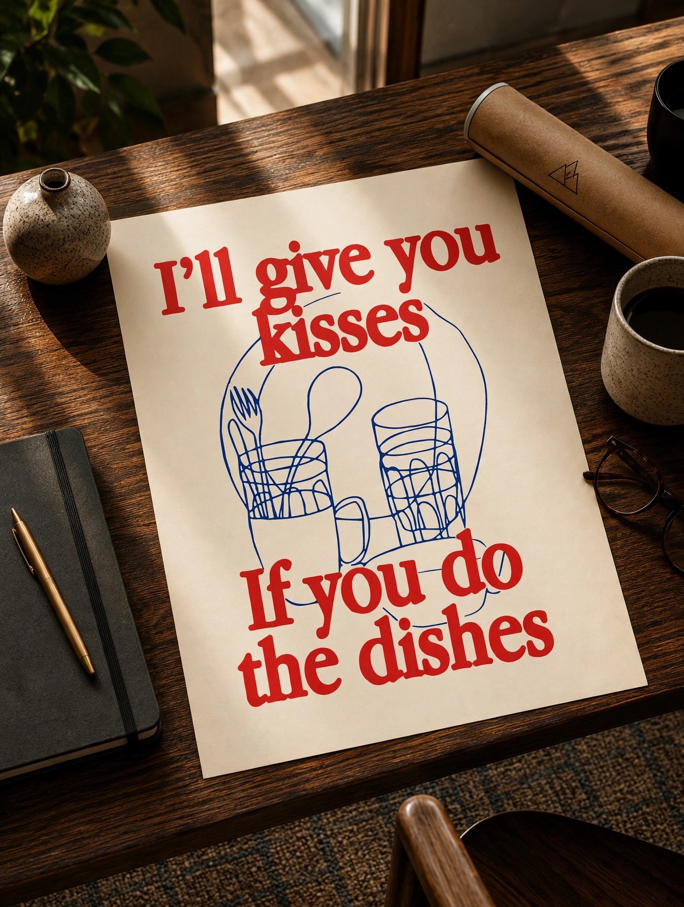 Kitchen quote print with red quote text and blue dish icons on a paper sheet