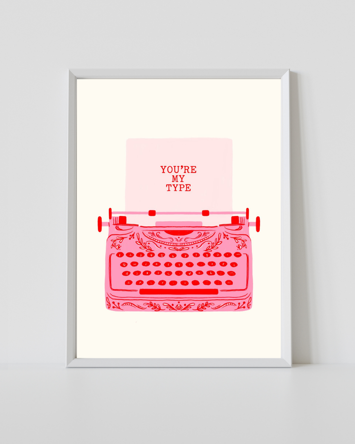 Typewriter Print featuring a vintage pink typewriter with the phrase "You're My Type" on a soft cream background.