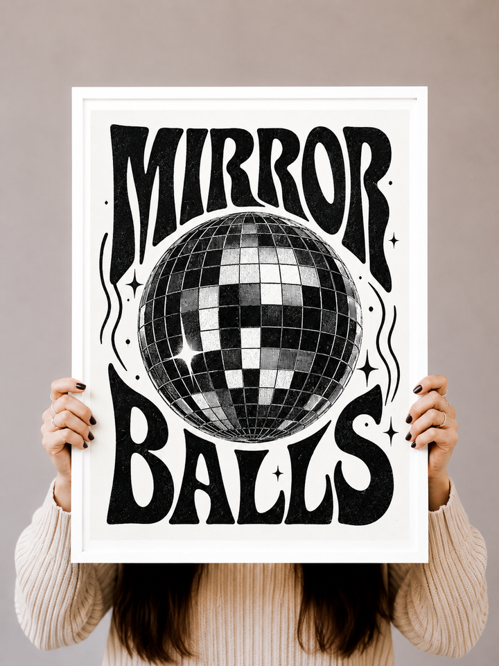 Mirror Ball Art Print displayed in a black frame within a warm modern living space
