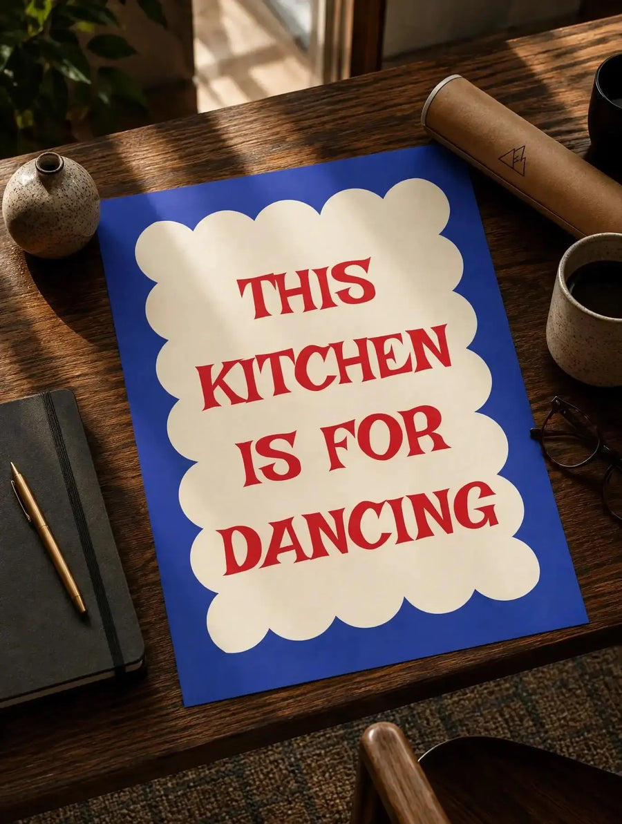 Kitchen quote print on wooden table, blue background, cream scalloped panel, red lettering