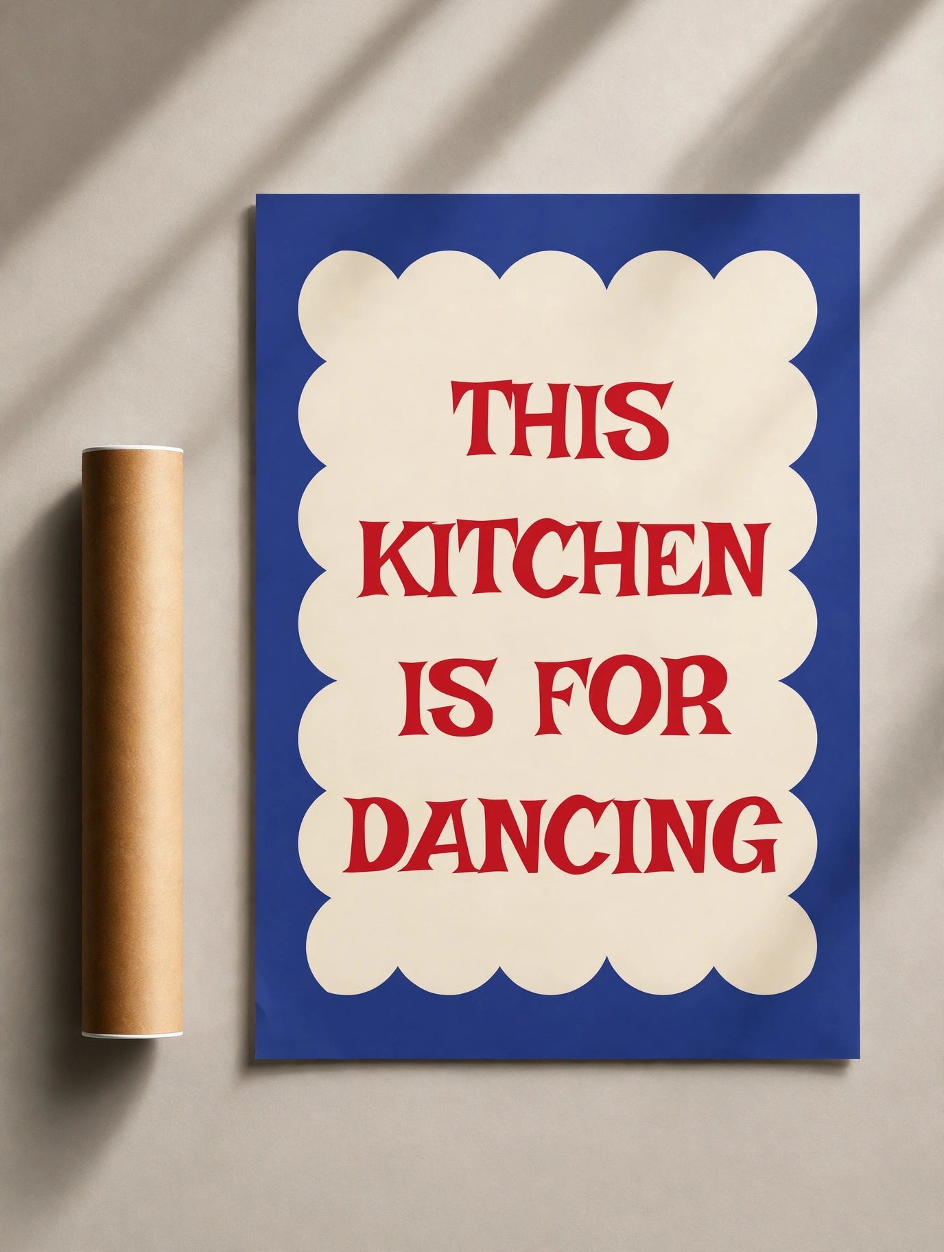 Kitchen quote print, blue poster with cream scalloped border and red “THIS KITCHEN IS FOR DANCING”.