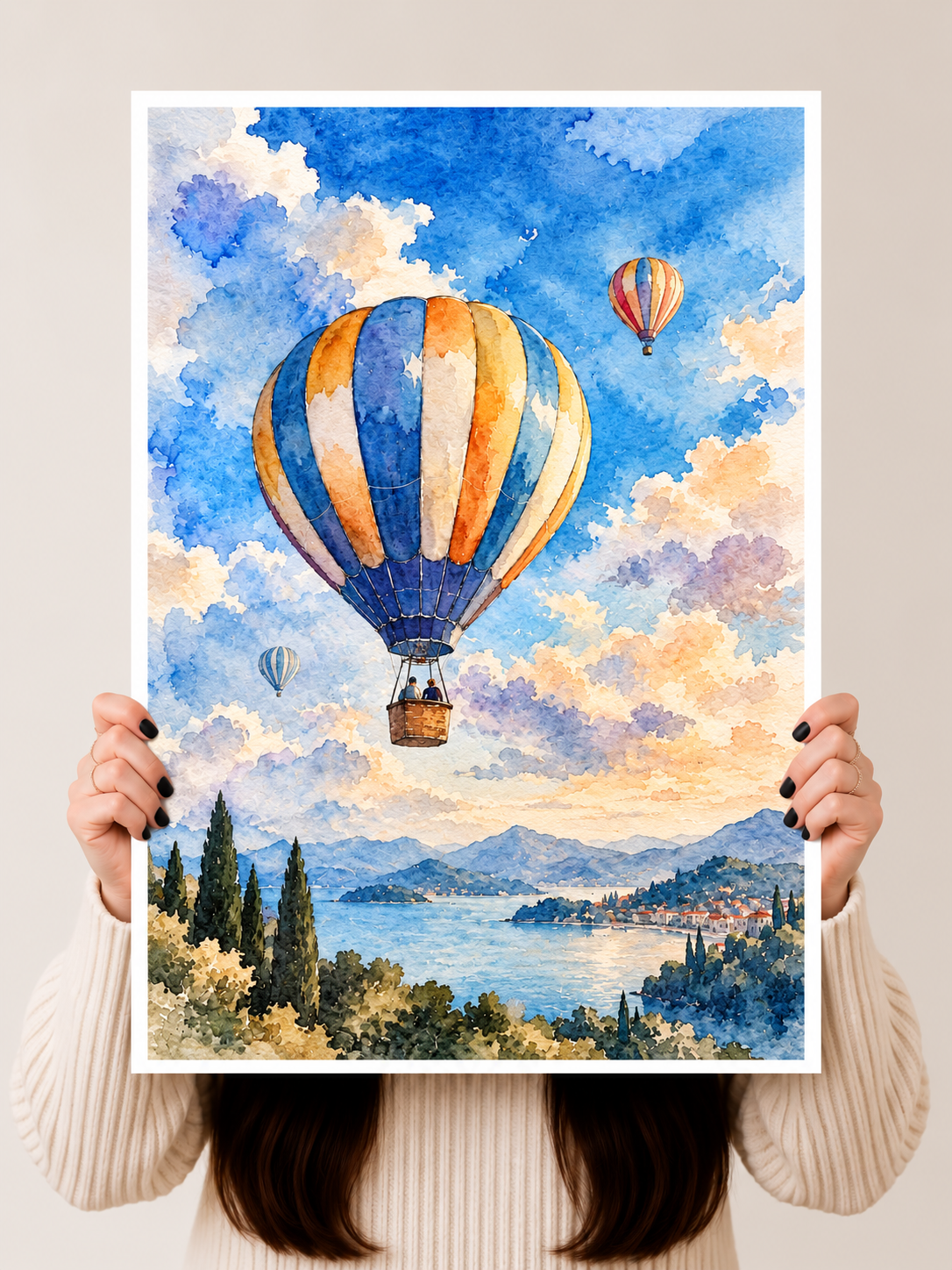 Hot Air Balloon Watercolor Art Print held vertically to show the vibrant blue sky and orange balloon details