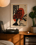 White-framed wall art poster with 'But First Coffee' design, cat, and coffee jug