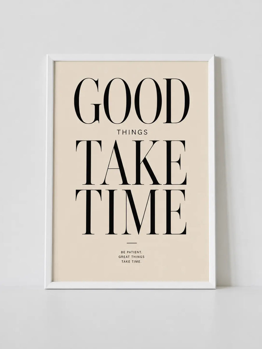 White-framed wall print with “GOOD THINGS TAKE TIME” typography on cream background