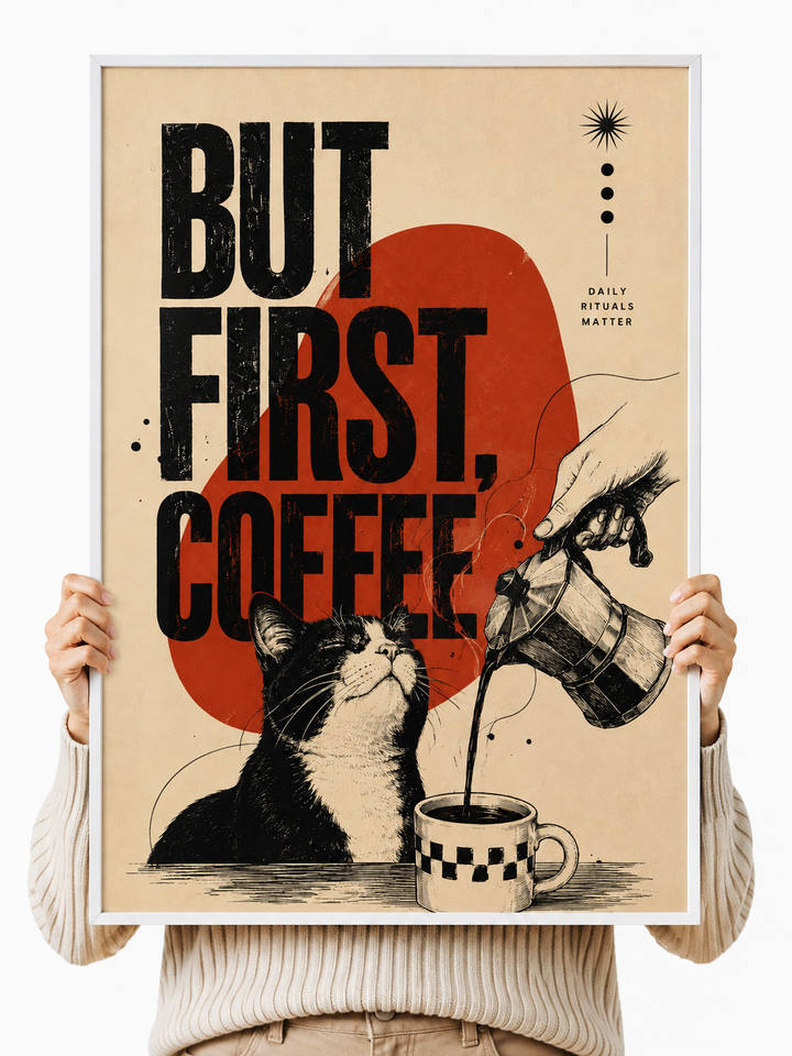 Unframed poster print held up, showing 'But First Coffee' text with cat and coffee mug