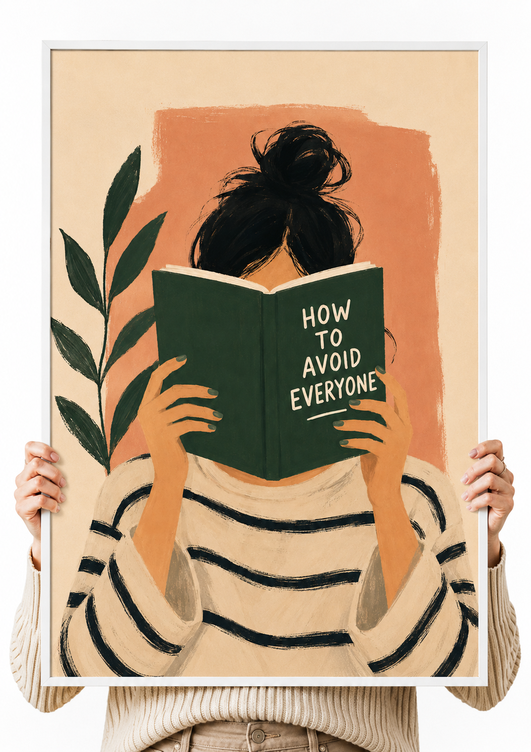 Framed wall art print held by hands, reading figure holding a green book with black hair