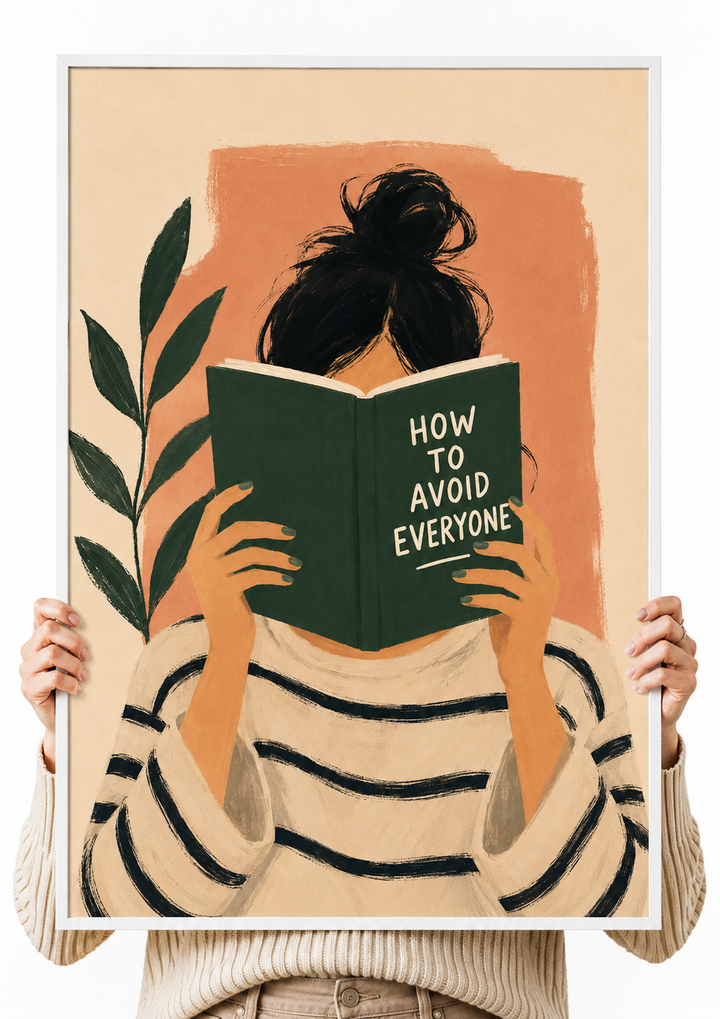 Framed wall art print held by hands, reading figure holding a green book with black hair