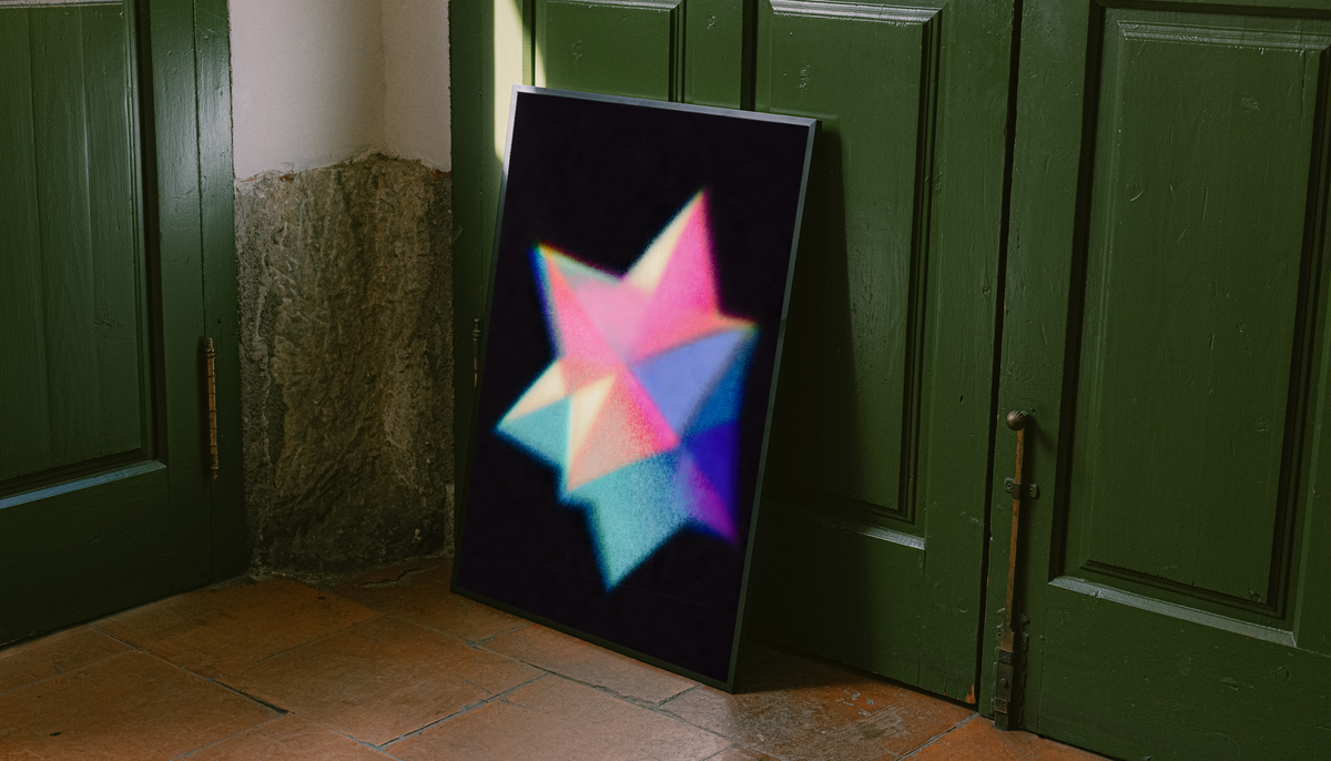 Overlapping pink cyan blue and purple geometric star shapes with grain and soft glow on black, styled in a black frame against dark green paneled doors above orange floor tiles