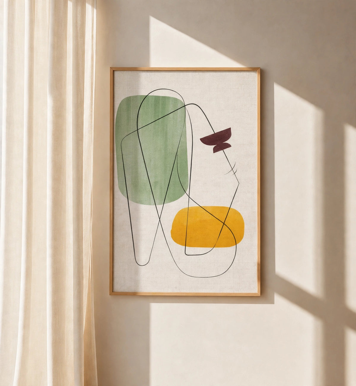 Brown wood framed geometric abstract wall art with green, yellow, and maroon shapes