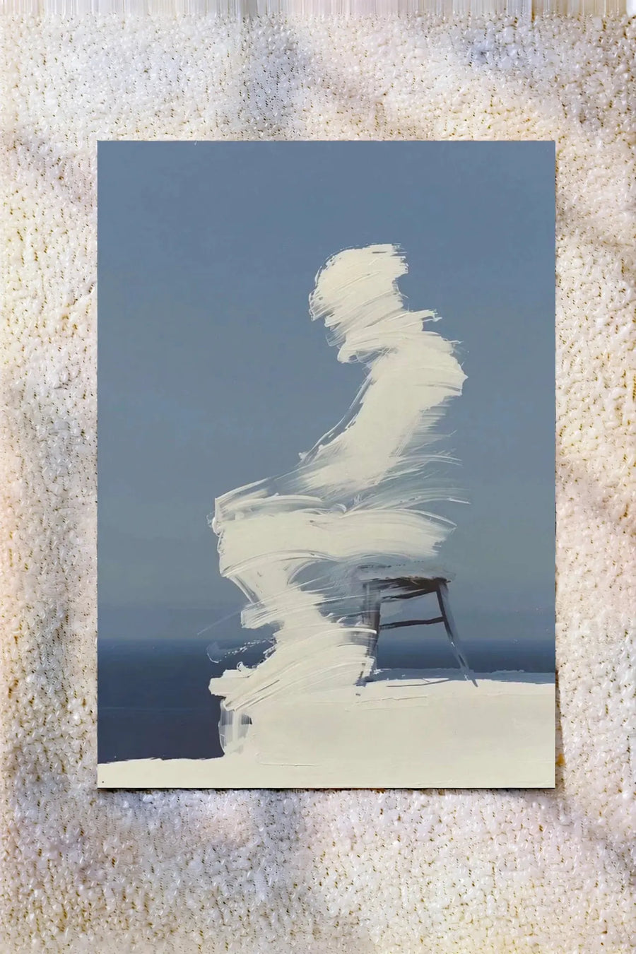 Abstract wall poster with blue background and white distressed seated figure on chair