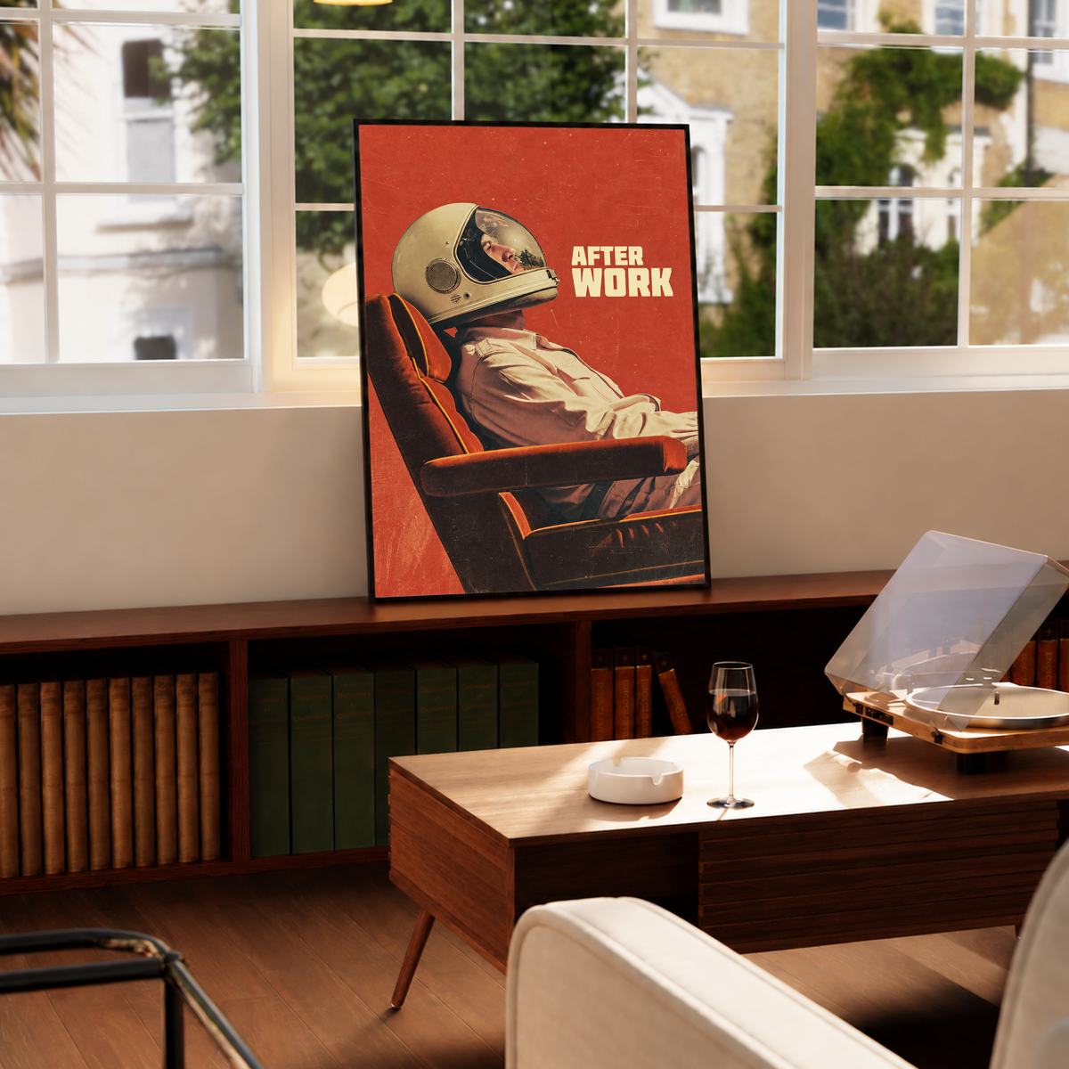An astronaut reclining in an armchair against a burnt-orange ground in a black frame by a bright window above a record player