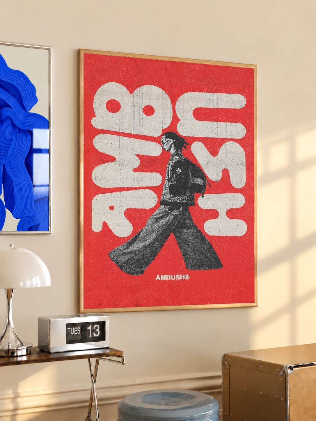 Red poster with white abstract typography and black walking figure in a light frame