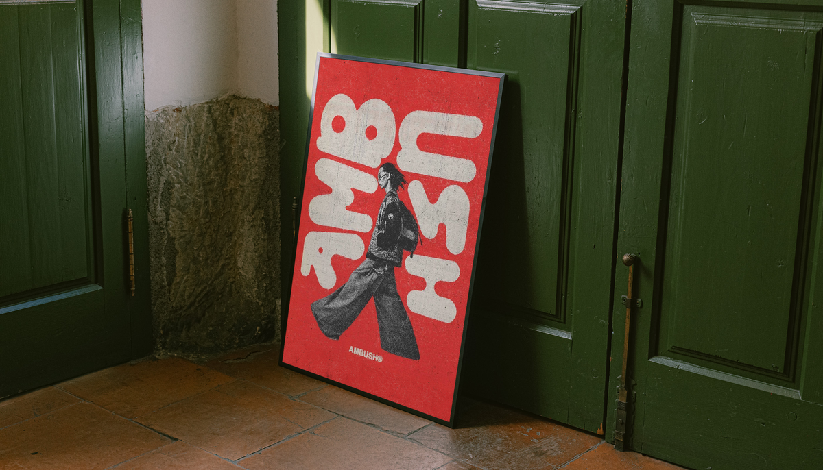 Red poster with white abstract typography and black walking figure in a black frame