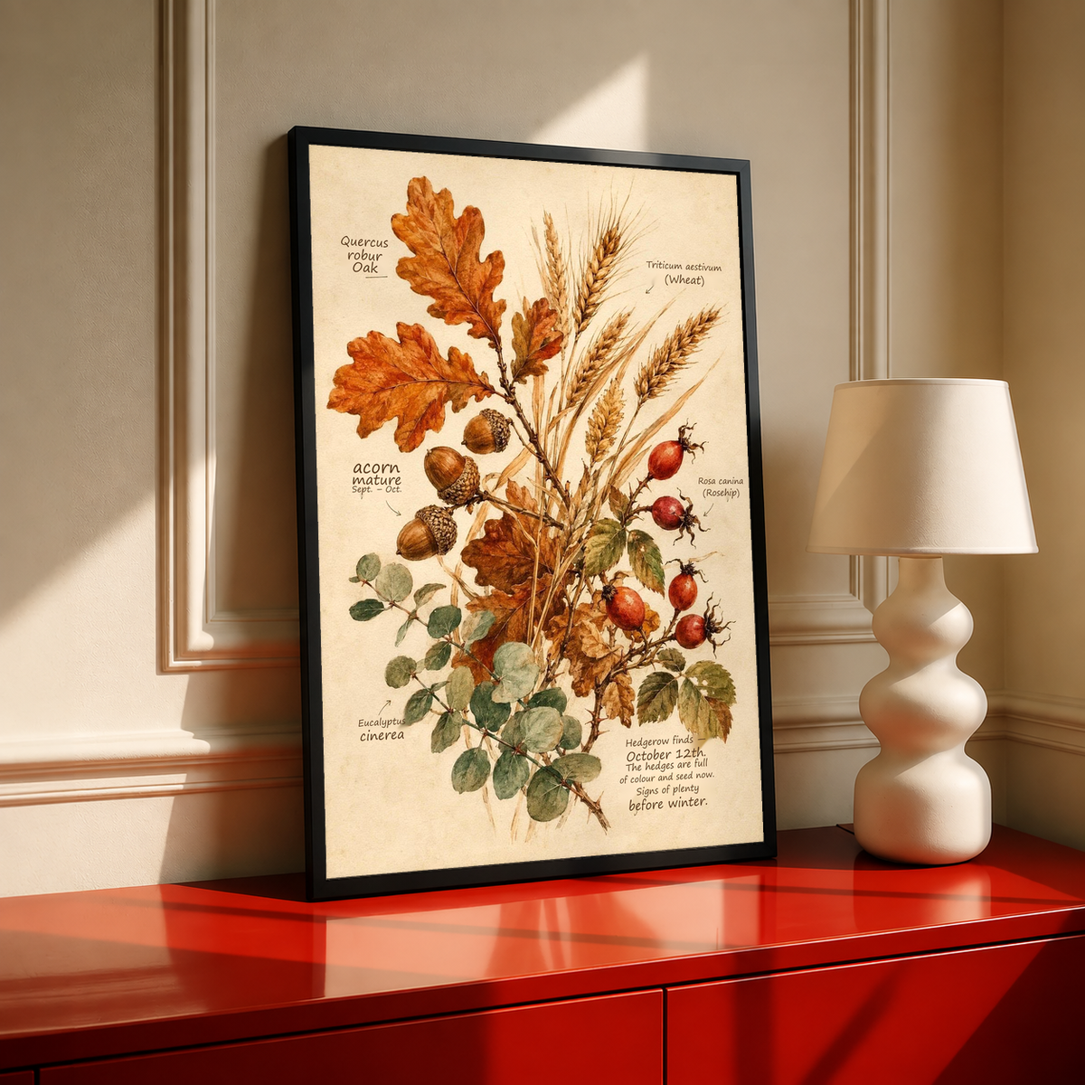 Black-framed botanical art print featuring oak leaves, wheat, and rose hips illustration.