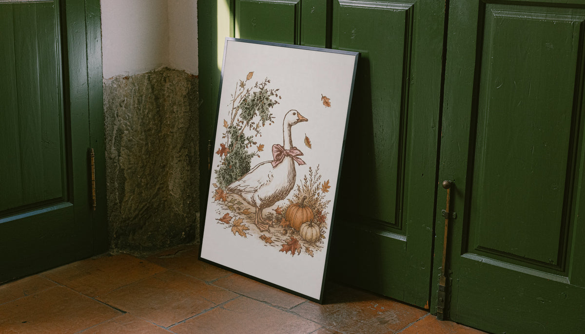 White goose with a rust pink bow among pumpkins and scattered autumn leaves as an unframed print leaning against a green panelled door