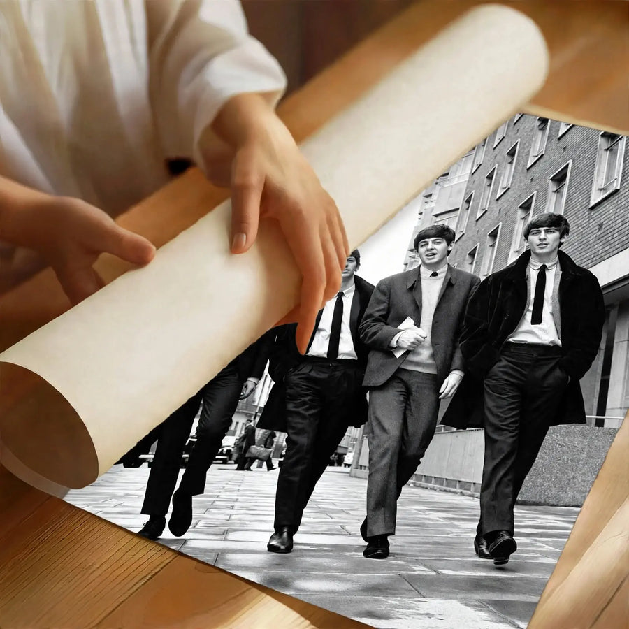 The Beatles Black and White Music Legends Poster partially rolled to show the physical print and black and white design