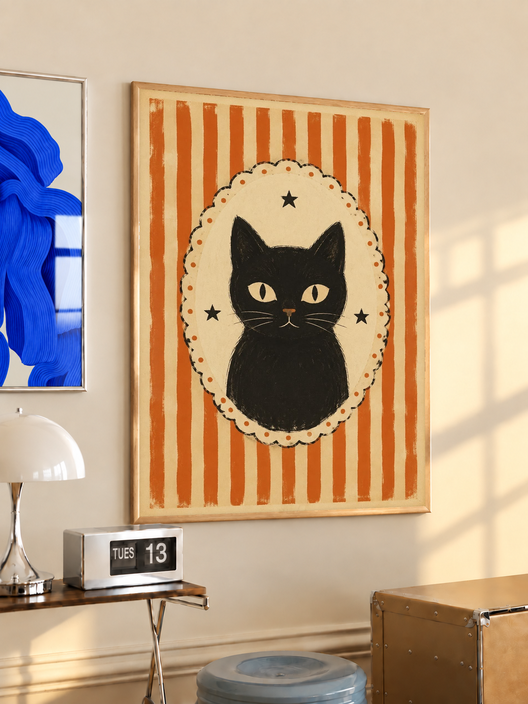 Framed cat cameo poster with orange vertical stripes and black cat in cream scalloped oval