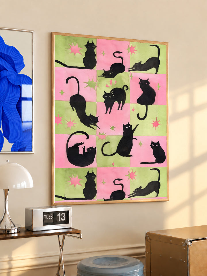 Framed cat silhouette print in pink and green checkerboard with shooting star shapes