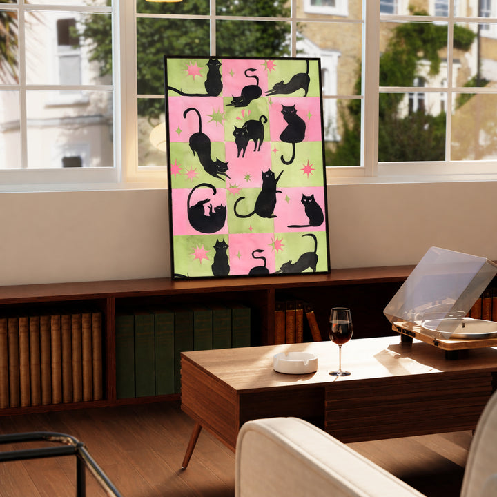 Cat silhouette framed poster with pink-and-green checkerboard layout and star details