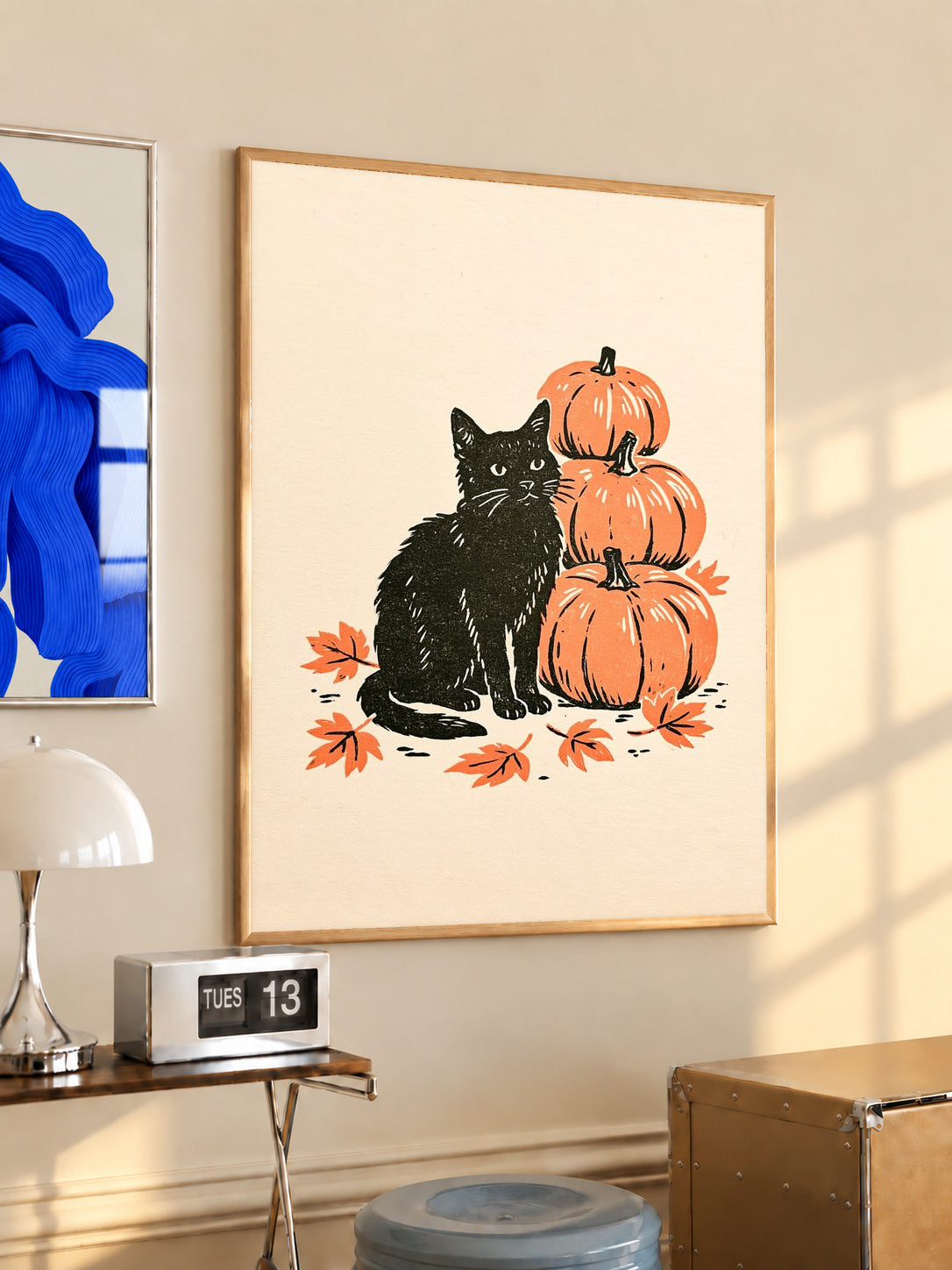 Oak-framed autumn linocut art print of black cat with stacked orange pumpkins