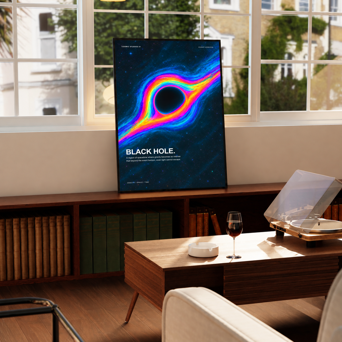 Black Hole Cosmic Studies poster with rainbow-colored accretion flow blue stars and Event Horizon labels, styled in a black frame above a wood console with books and a record player