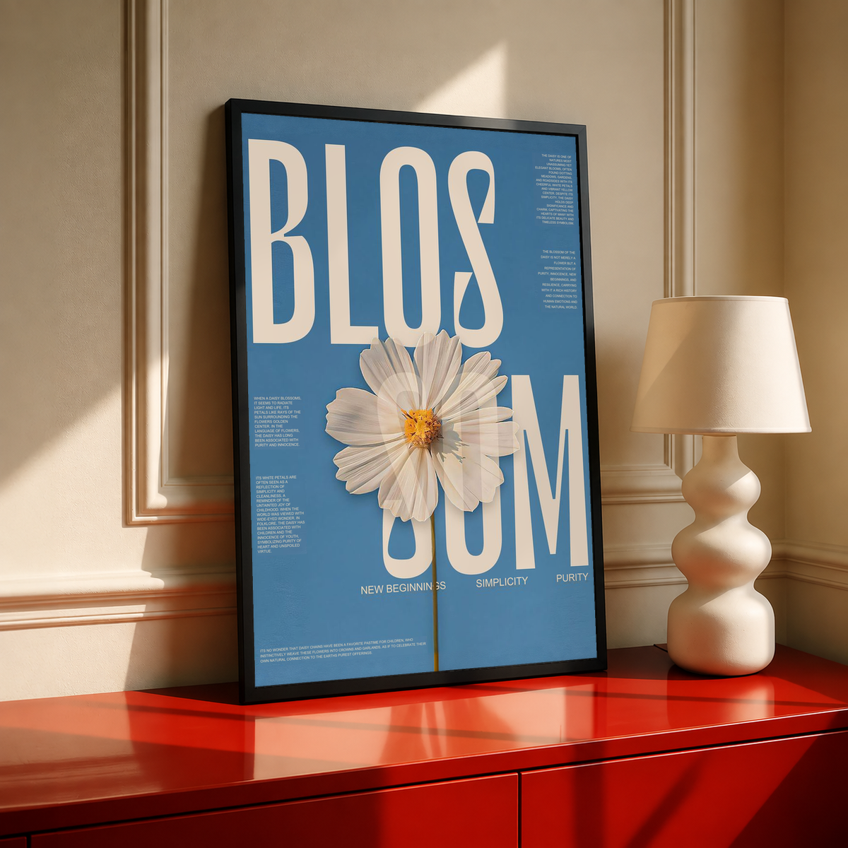 Tall framed blue poster featuring cream text and a white daisy flower with orange center