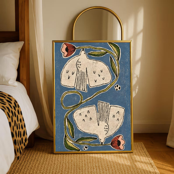 Framed folk floral poster standing on rug: cream flowers, coral buds, green curving stems