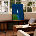 Blue ocean wall art print with small sailboat and green shoreline curve