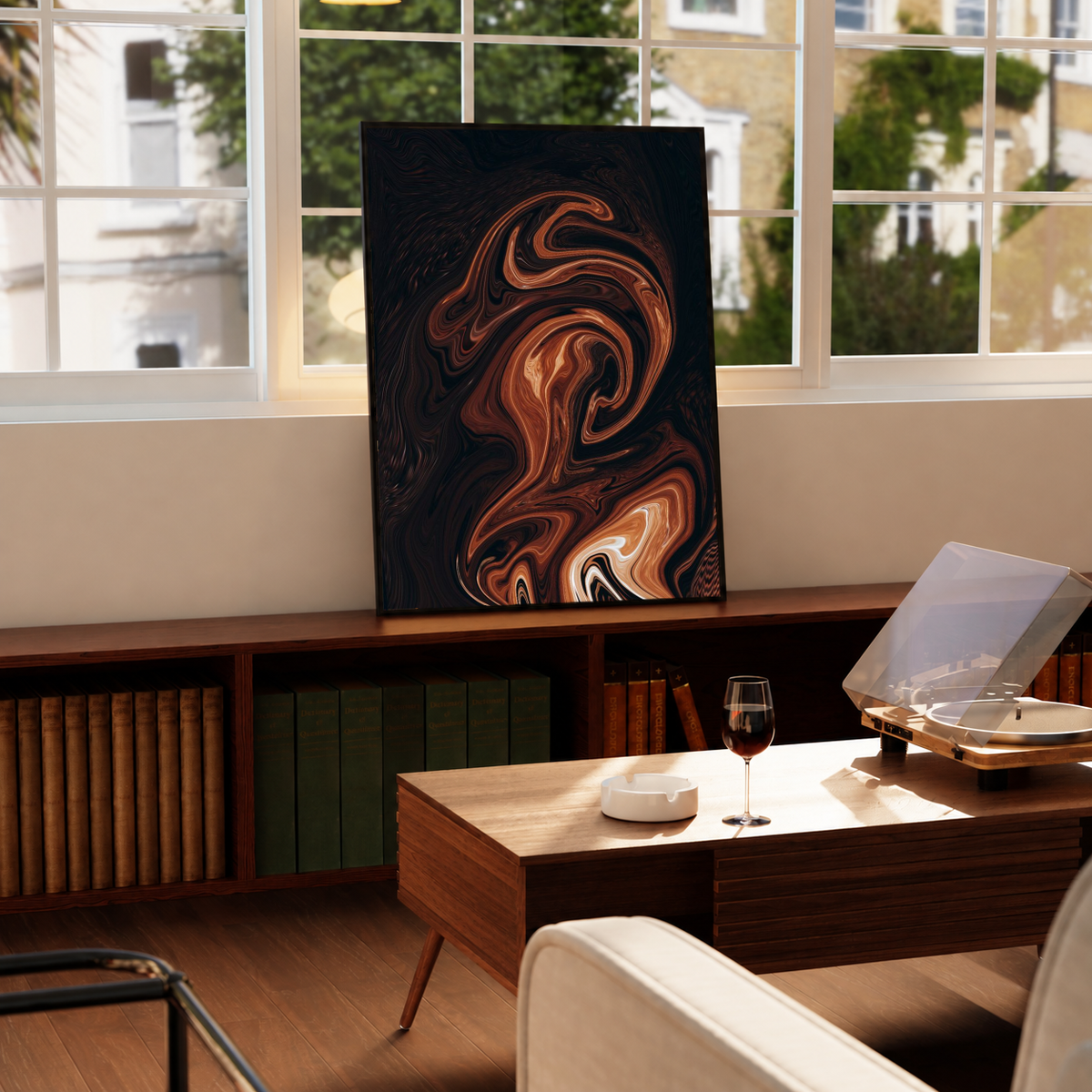 Brown Marble Abstract Wall Art in a black frame near a window and wooden table in a sunlit sitting room.