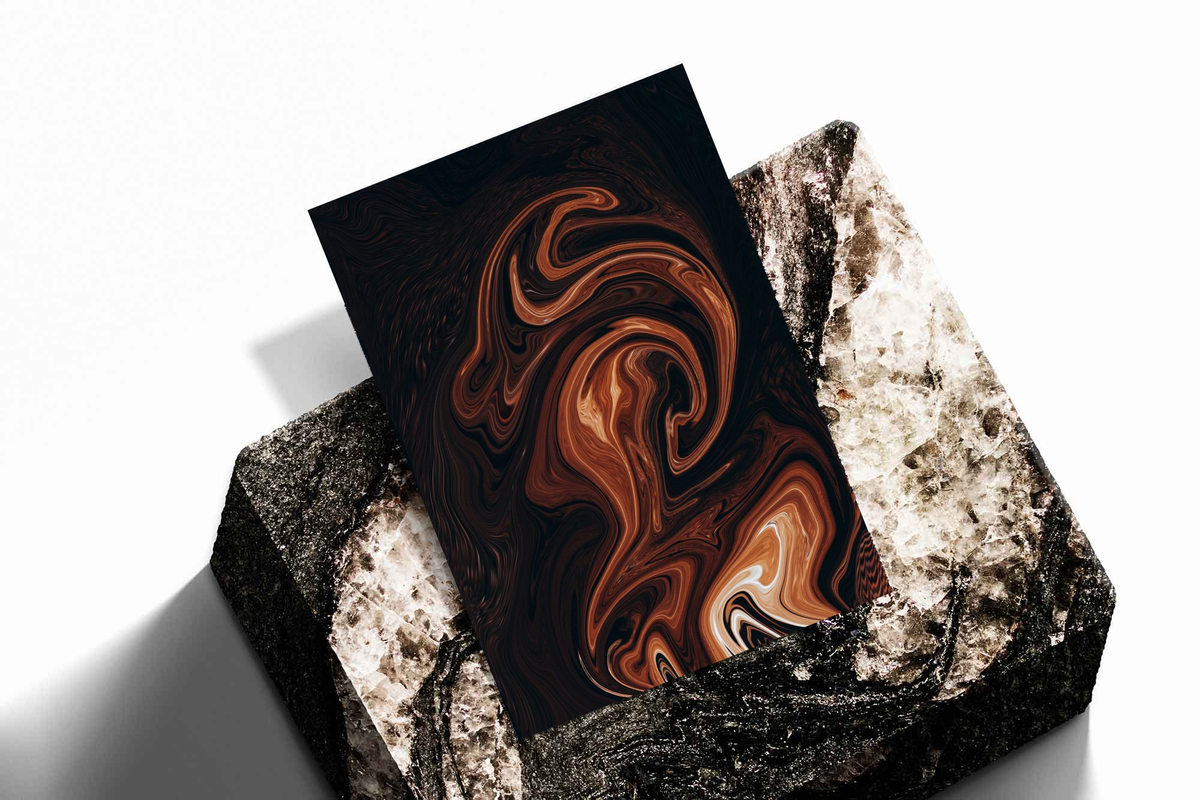 Unframed artwork depicting flowing marble-like swirls, presented diagonally on rough stone.
