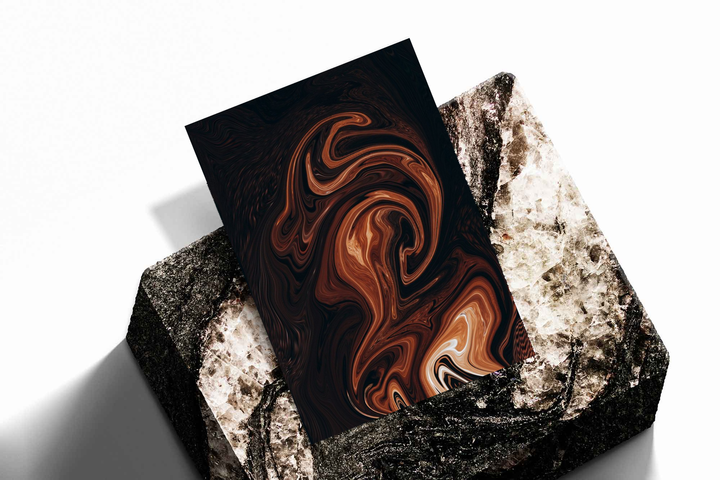 Unframed artwork depicting flowing marble-like swirls, presented diagonally on rough stone.