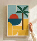 Bauhaus-style tropical art print in white frame, palm leaves over geometric blocks