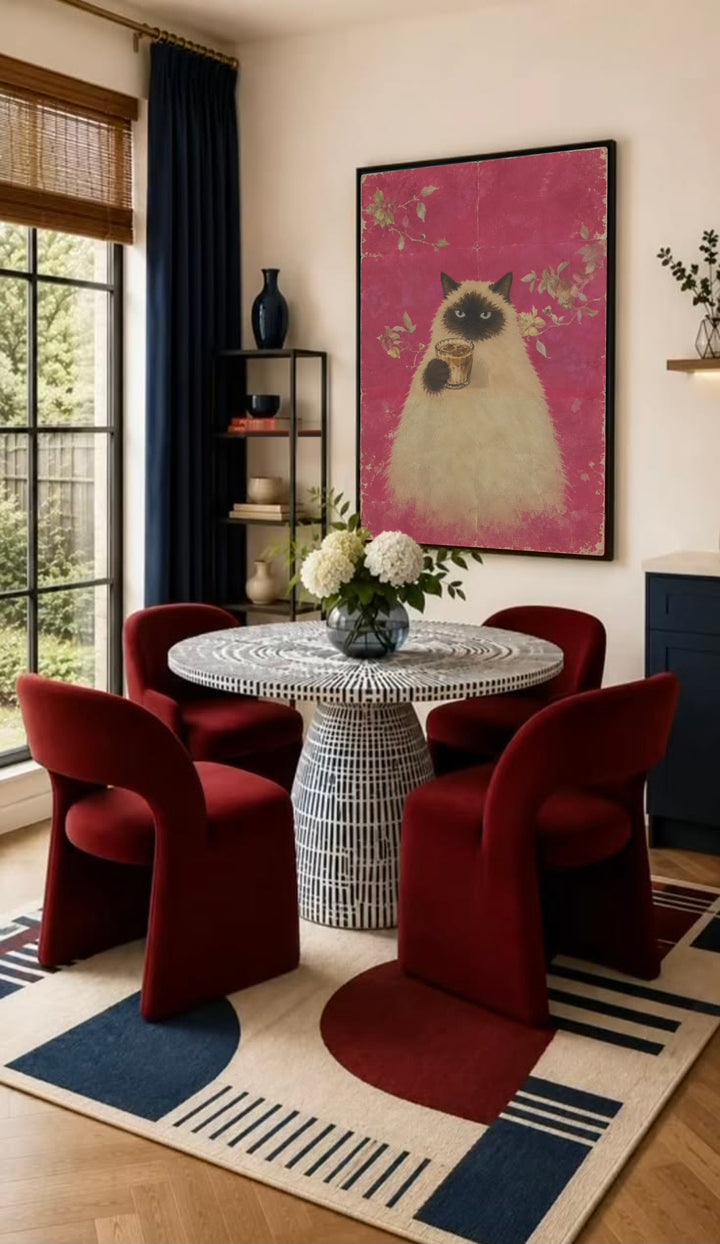 Framed poster of a fluffy cat holding a cup of coffee, on pink floral background