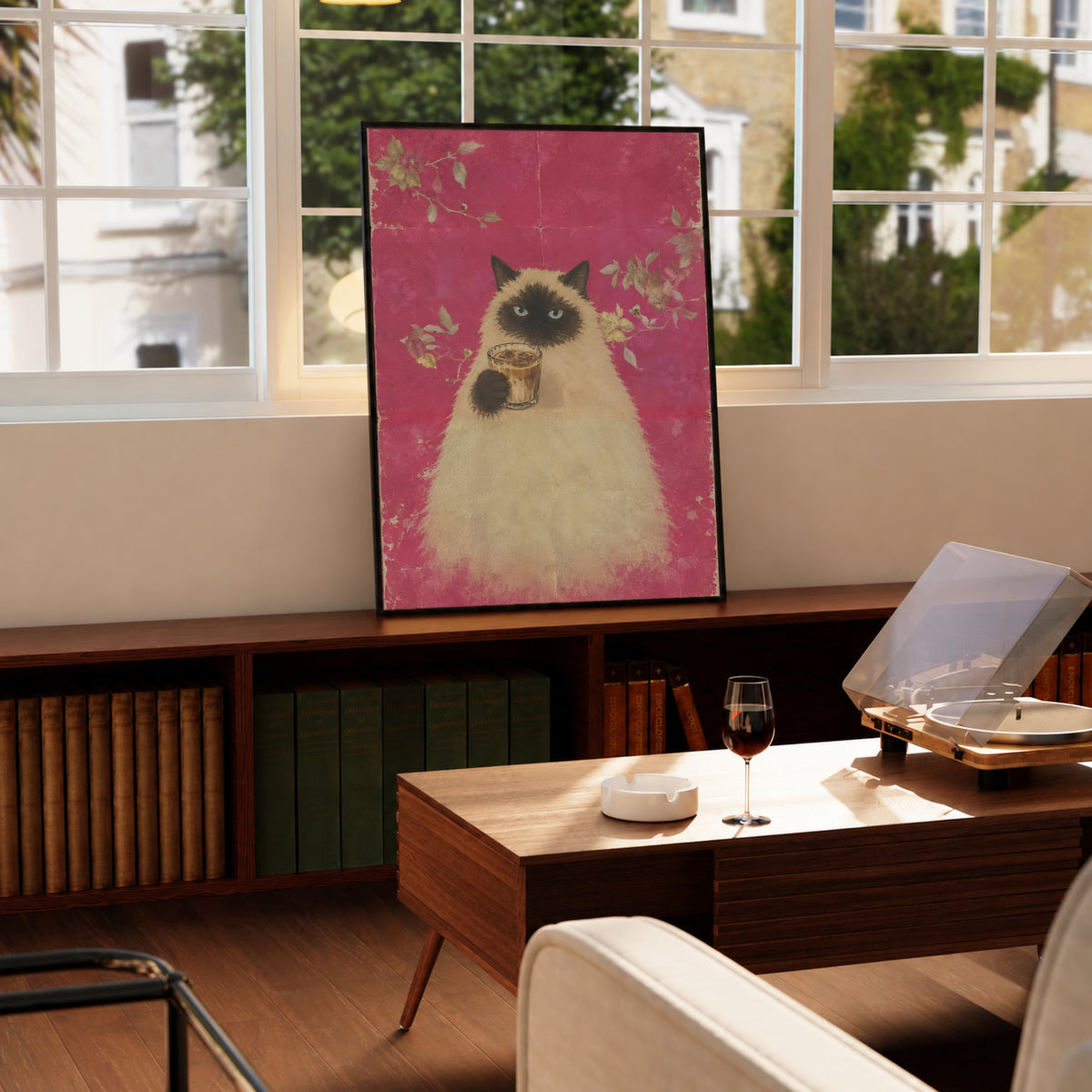 Framed cat holding a cup of coffee on pink floral background