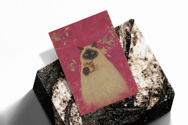 Angled art print featuring a fluffy cat holding a cup of coffee on pink floral background