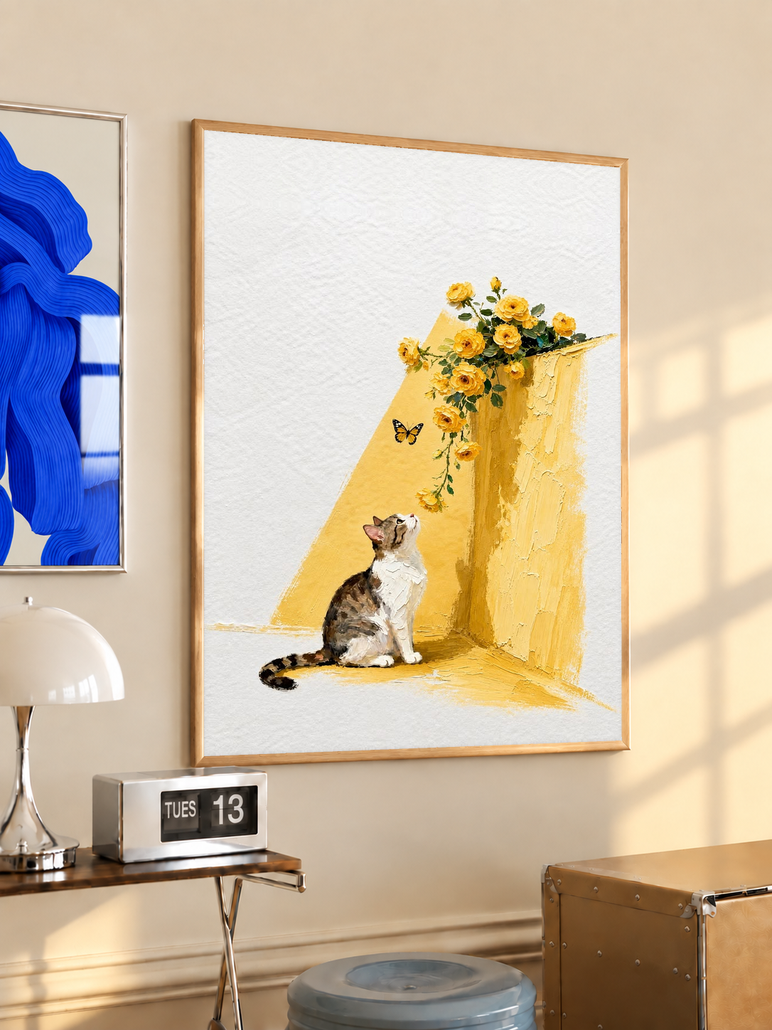 Framed cat art print with yellow floral bouquet, butterflies, and cat sitting by a wall