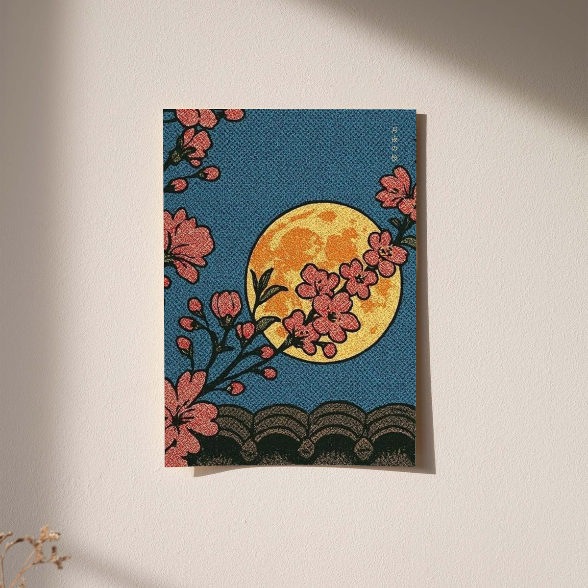 Cherry blossoms, yellow moon and patterned waves as an unframed print against a pale plaster wall with soft shadows
