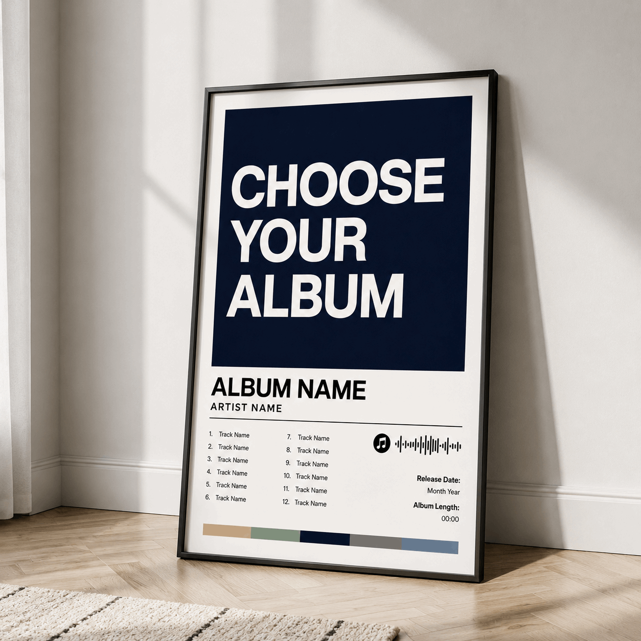 Custom album poster in black frame, dark blue “CHOOSE YOUR ALBUM” template on the floor